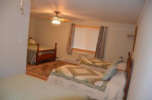 Lake Fork Farm | Queen Bed. Spacious separate full kitchen/ dining/living room. Accommodates 6 guests.